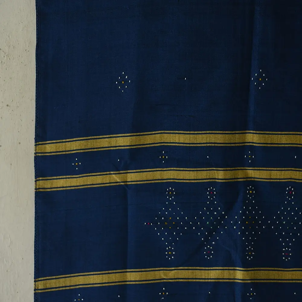 tangaliya handloom cotton stole in deep indigo blue with mustard yellow stripes, raised white dana dot motifs, and hand-knotted fringe tassels