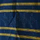 tangaliya handloom cotton stole in deep indigo blue with mustard yellow stripes, raised white dana dot motifs, and hand-knotted fringe tassels