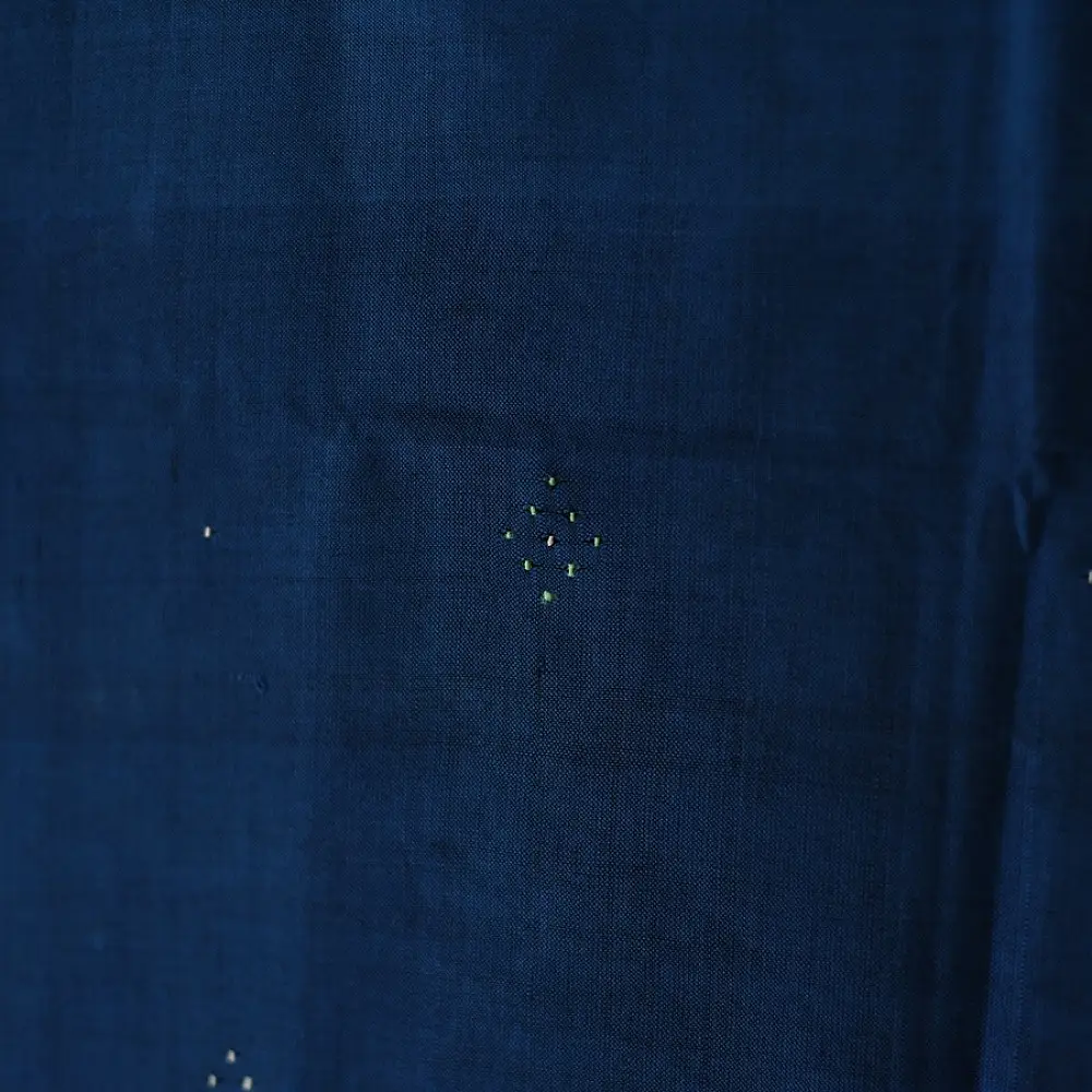 tangaliya handloom cotton stole in deep indigo blue with mustard yellow stripes, raised white dana dot motifs, and hand-knotted fringe tassels