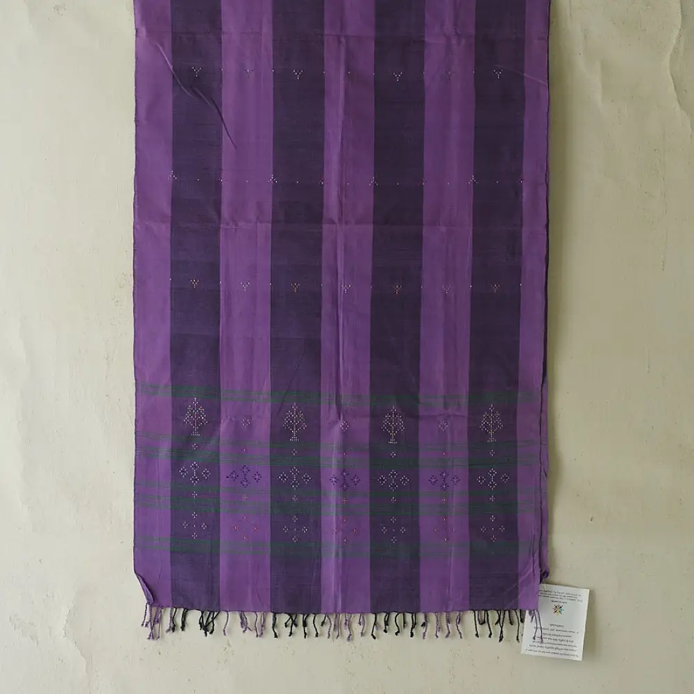tangaliya handloom cotton stole with purple and dark charcoal vertical stripes, green and white raised dana dotwork motifs, and hand-knotted fringe tassels