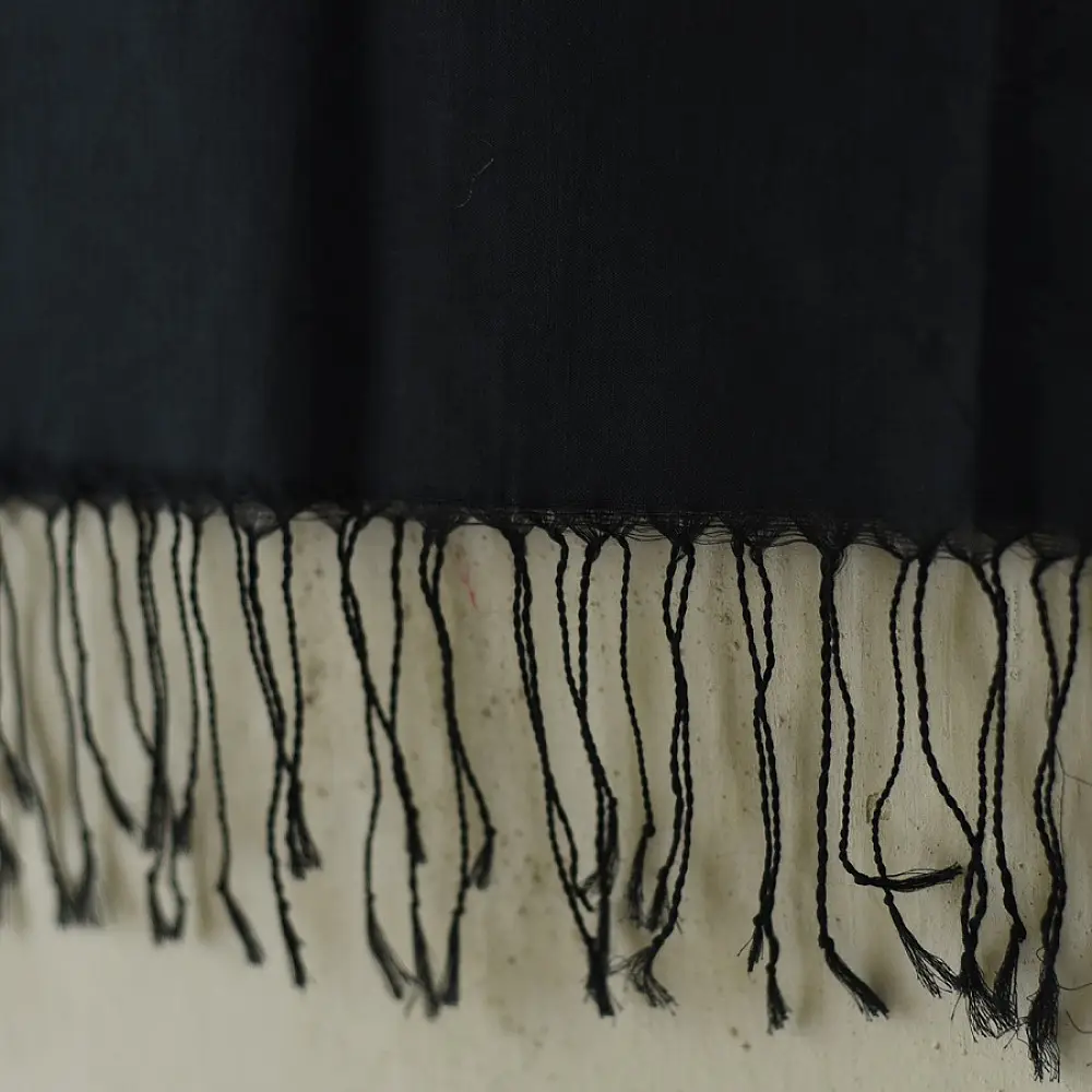 tangaliya handloom cotton stole in charcoal black with maroon stripes, white raised dana bead motif, and hand-knotted fringe tassels