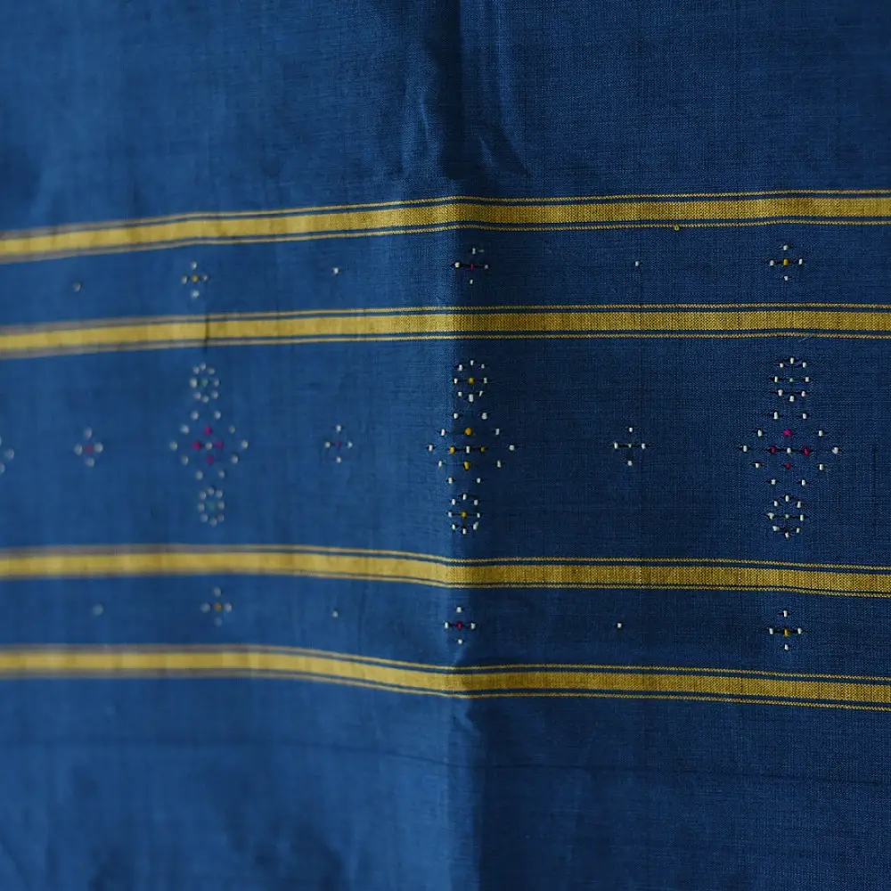 tangaliya handloom cotton stole in indigo royal blue with mustard yellow stripes, hand-woven white dana dot motifs, and knotted fringe tassels