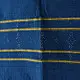 tangaliya handloom cotton stole in indigo royal blue with mustard yellow stripes, hand-woven white dana dot motifs, and knotted fringe tassels