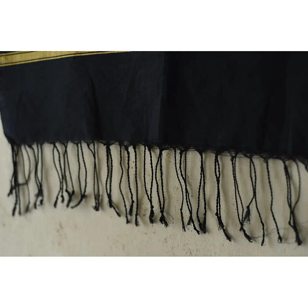 tangaliya handloom cotton stole in jet black, raised white and terracotta dana dots, and hand-knotted fringe tassels