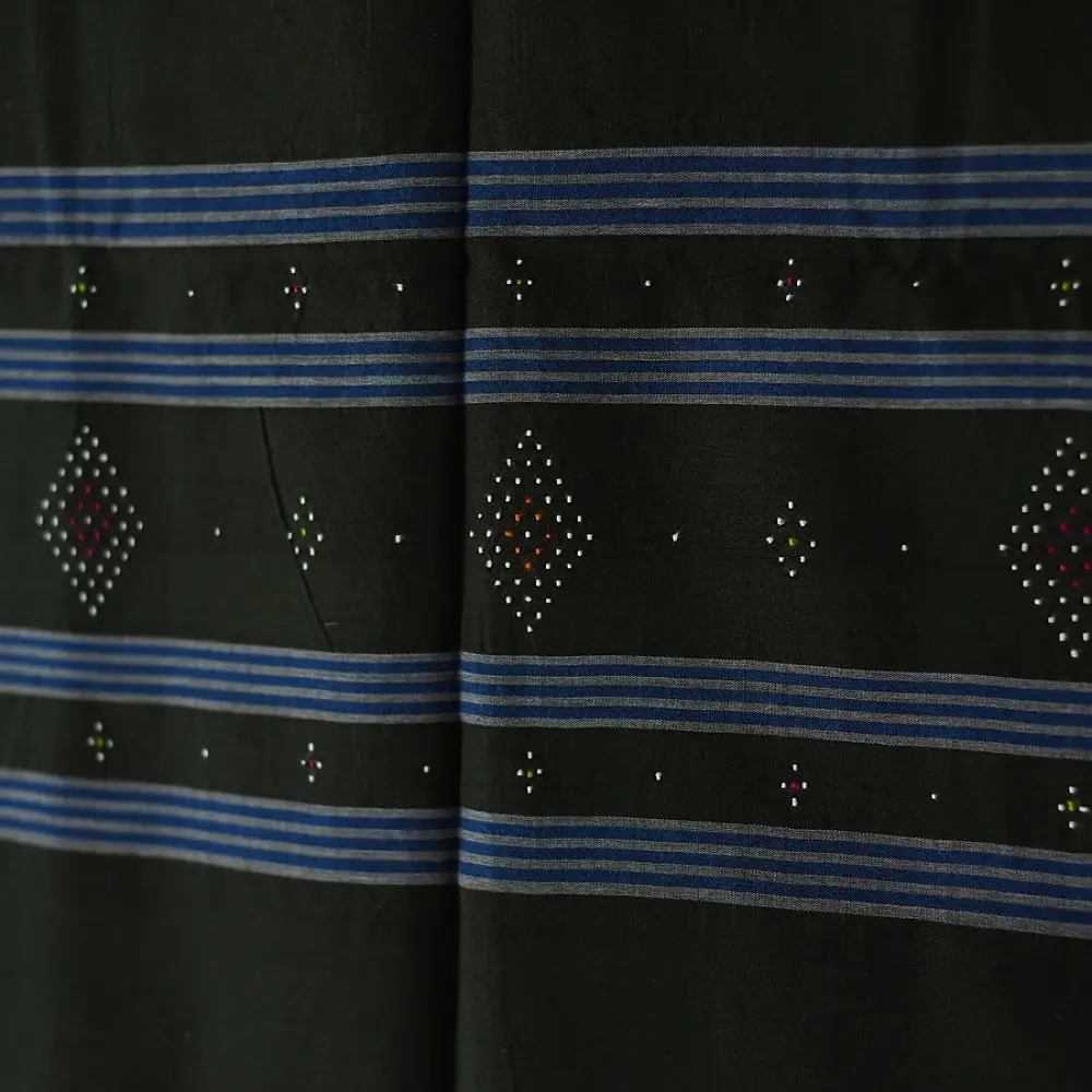 tangaliya handloom cotton stole in classic black with subtle indigo blue stripes, raised white dana dotwork motifs, and hand-knotted tassels   
