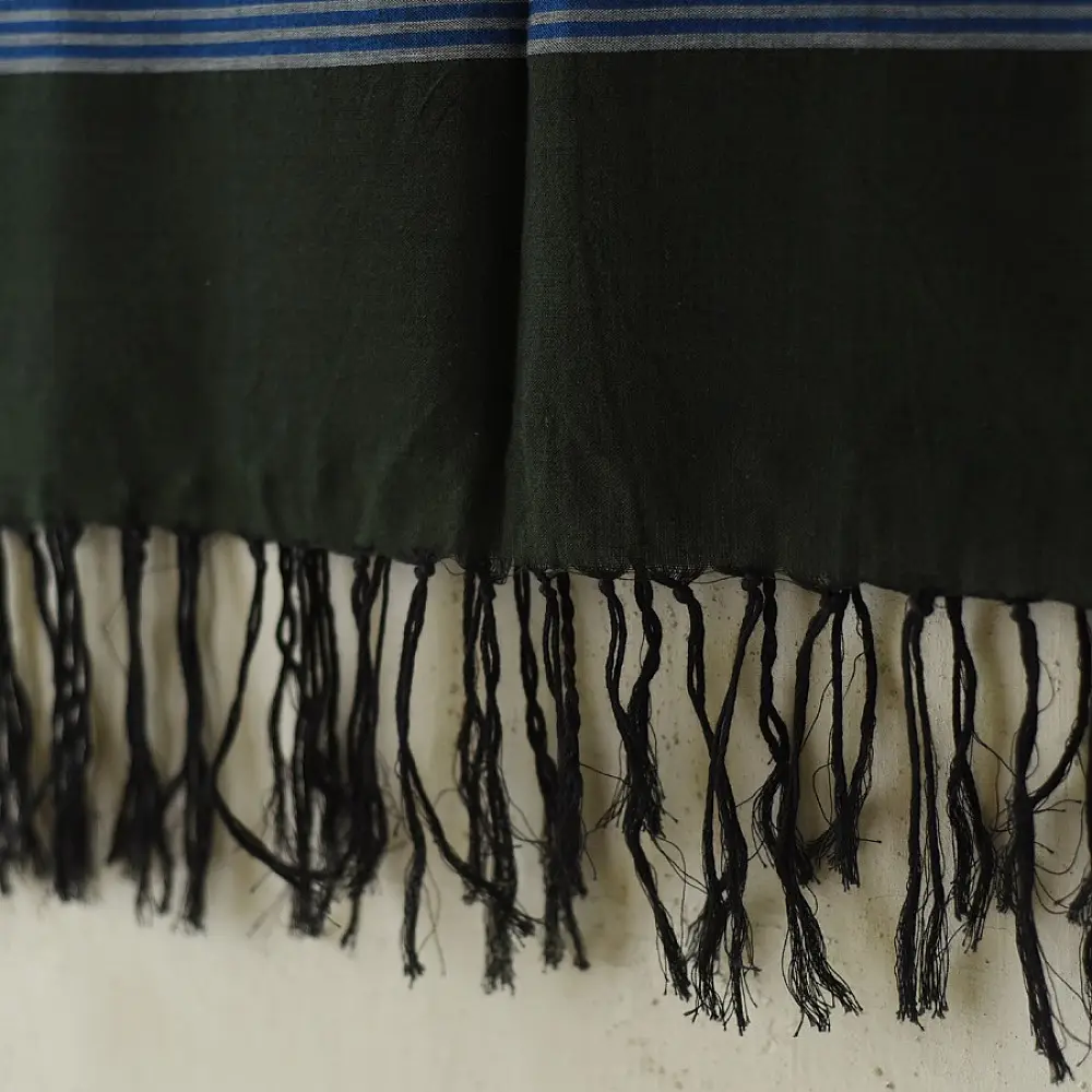 tangaliya handloom cotton stole in classic black with subtle indigo blue stripes, raised white dana dotwork motifs, and hand-knotted tassels   