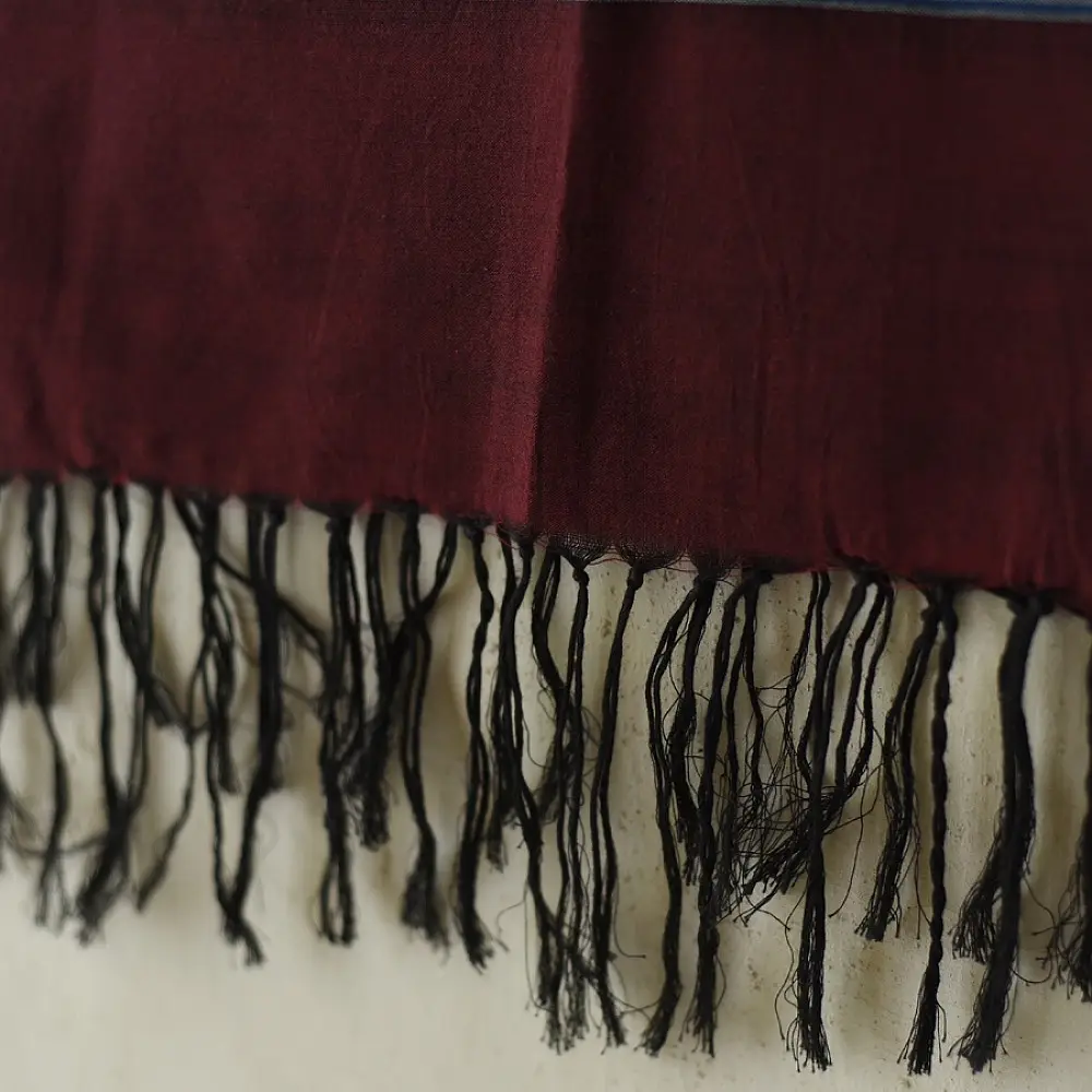 tangaliya handloom cotton stole in deep wine maroon with teal blue stripes, white raised dana bead motifs, and hand-knotted fringe tassels