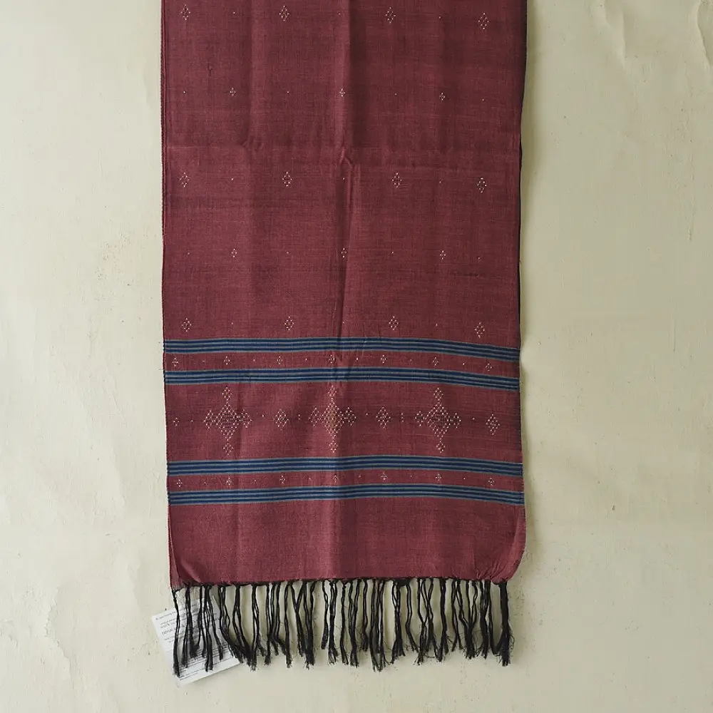 tangaliya handloom cotton stole in classic black with subtle indigo blue stripes, raised white dana dotwork motifs, and hand-knotted tassels   