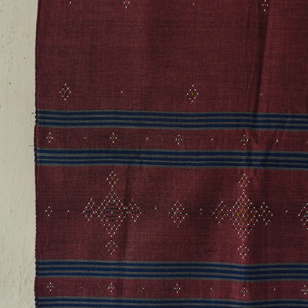 tangaliya handloom cotton stole in classic black with subtle indigo blue stripes, raised white dana dotwork motifs, and hand-knotted tassels   