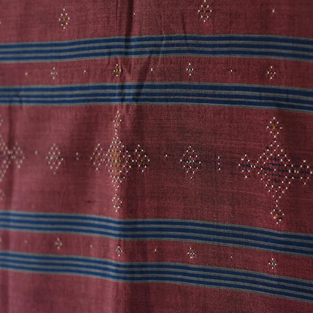 tangaliya handloom cotton stole in classic black with subtle indigo blue stripes, raised white dana dotwork motifs, and hand-knotted tassels   