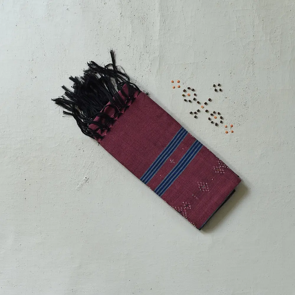 tangaliya handloom cotton stole in classic black with subtle indigo blue stripes, raised white dana dotwork motifs, and hand-knotted tassels   