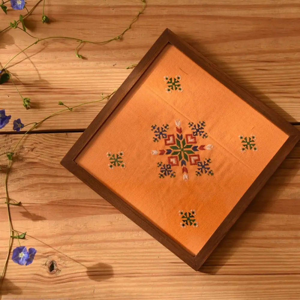 handmade wooden tray with orange soof embroidered fabric and star motif