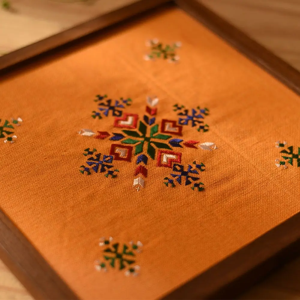 handmade wooden tray with orange soof embroidered fabric and star motif