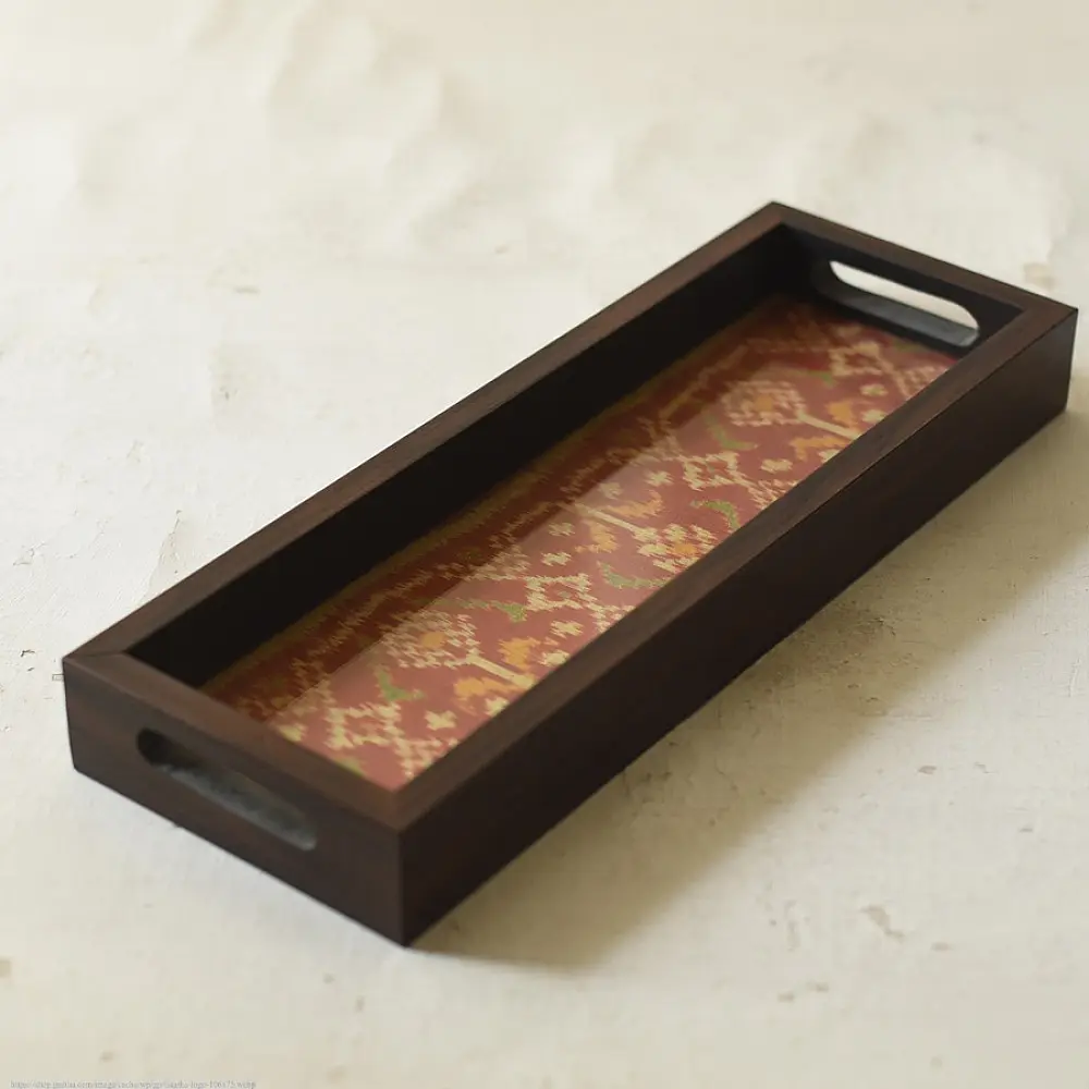 handmade wooden tray with orange patola silk print and cutout handle