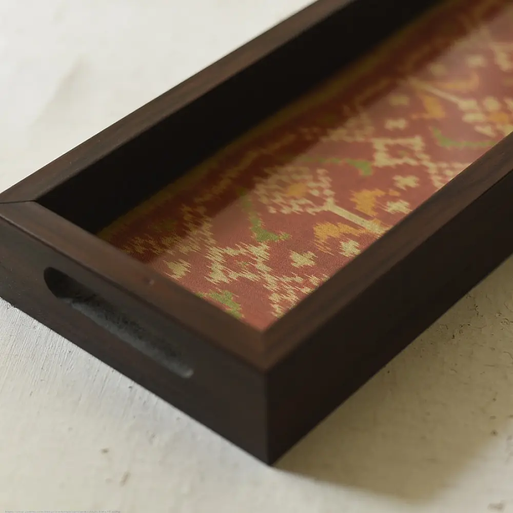 handmade wooden tray with orange patola silk print and cutout handle