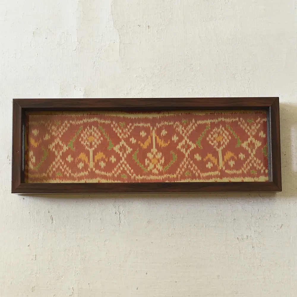 handmade wooden tray with orange patola silk print and cutout handle