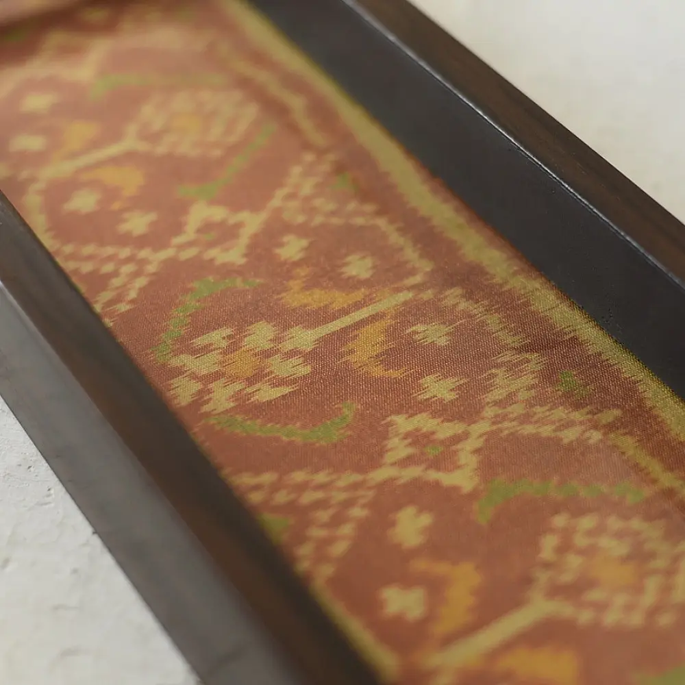 handmade wooden tray with orange patola silk print and cutout handle