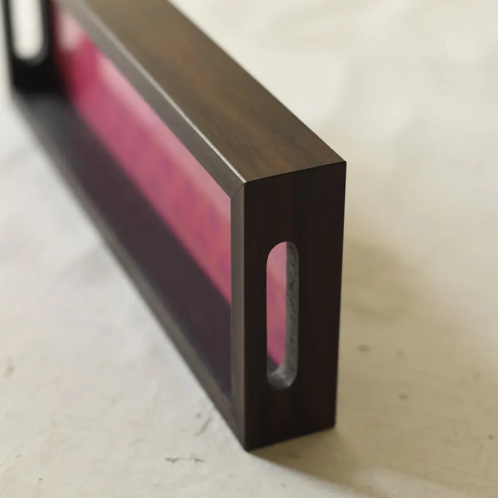 handmade wooden tray with pink patola silk print and cutout handle
