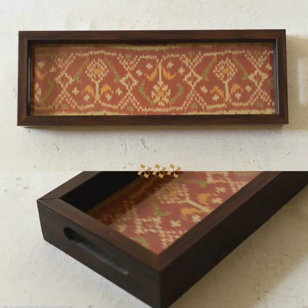 handmade wooden tray with orange patola silk print and cutout handle