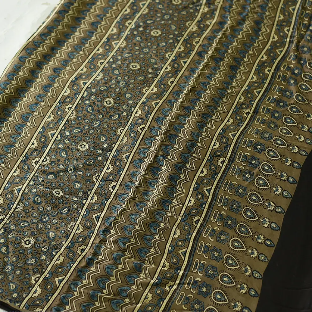 moss green mustard gold ajrakh modal silk saree hand block printed floral sprig body traditional geometric borders ethnic wear sustainable luxury natural dyed with tassels
