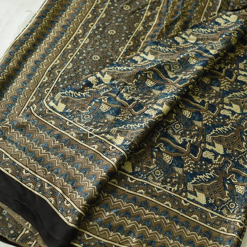 moss green mustard gold ajrakh modal silk saree hand block printed floral sprig body traditional geometric borders ethnic wear sustainable luxury natural dyed with tassels