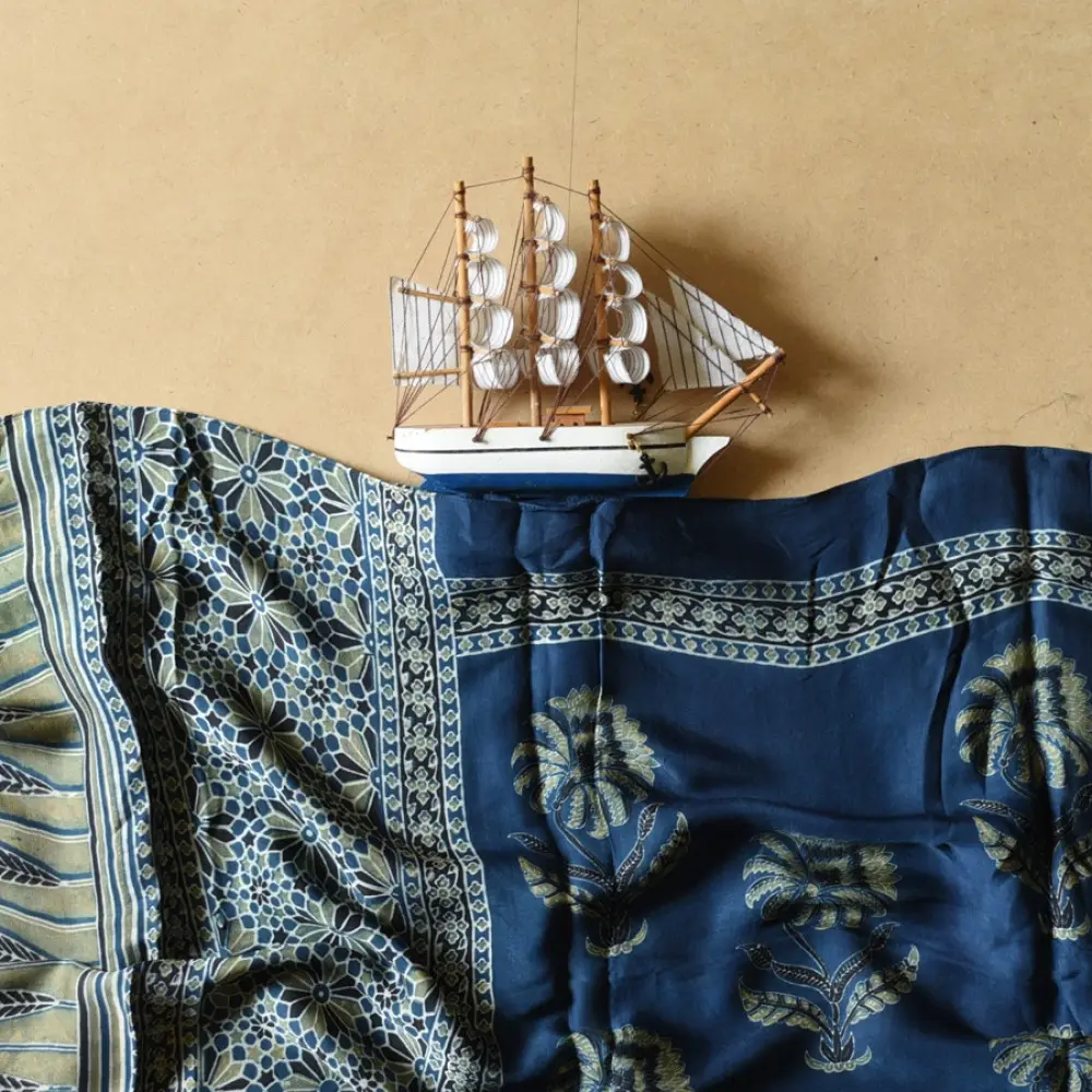 deep indigo blue moss green ajrakh modal silk dupatta hand block printed floral buta motif body ornate star medallion pallu traditional mihrab arched detail wedding festive wear sustainable luxury natural dyed with tassels