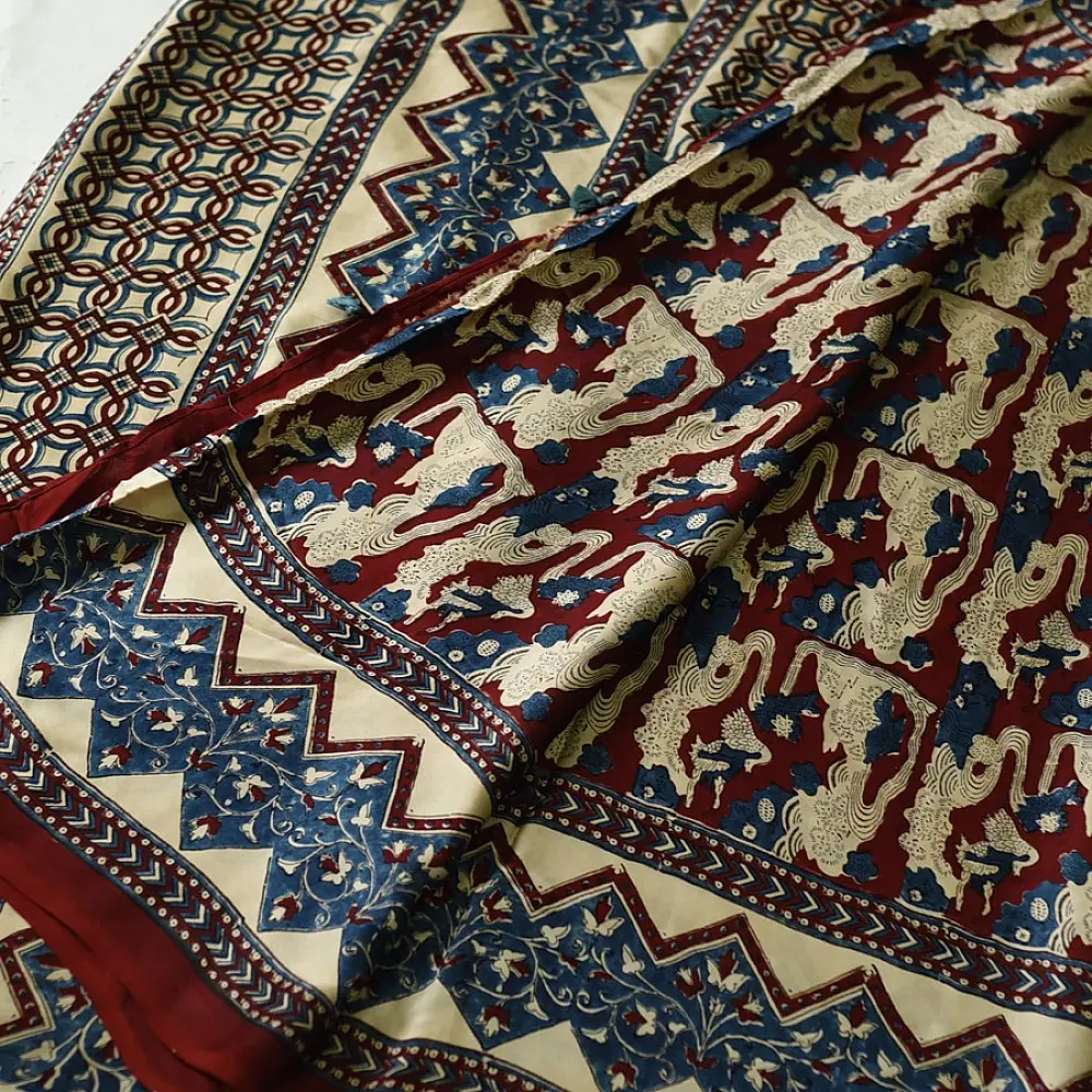 cream indigo blue madder red ajrakh cotton saree hand block printed floral vine pallu interlocking circular motifs traditional ethnic wear sustainable fashion natural dyed