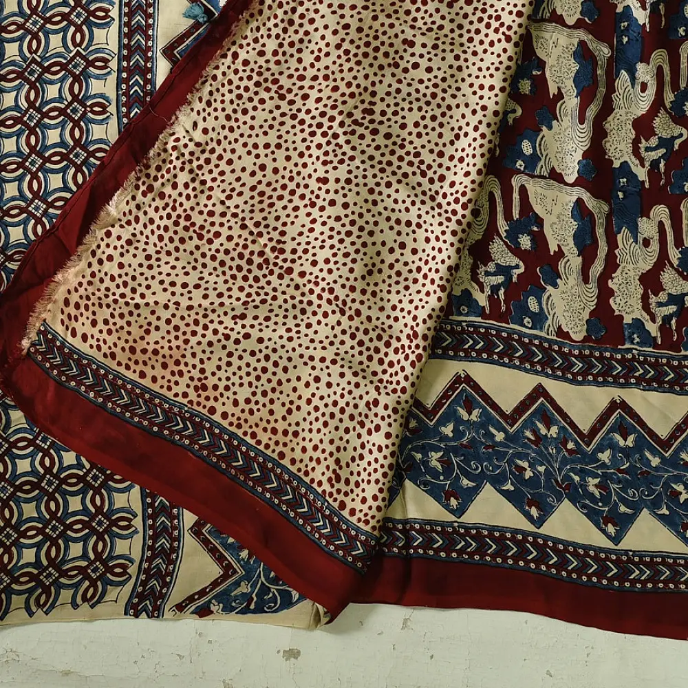cream indigo blue madder red ajrakh cotton saree hand block printed floral vine pallu interlocking circular motifs traditional ethnic wear sustainable fashion natural dyed