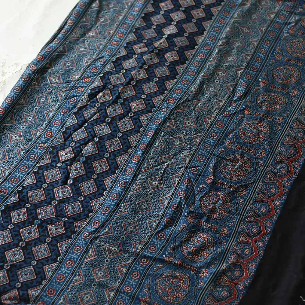 deep indigo blue madder red ajrakh modal silk saree hand block printed geometric buti body bundi medley polka dot pallu traditional ethnic wear sustainable luxury natural dyed with tassels