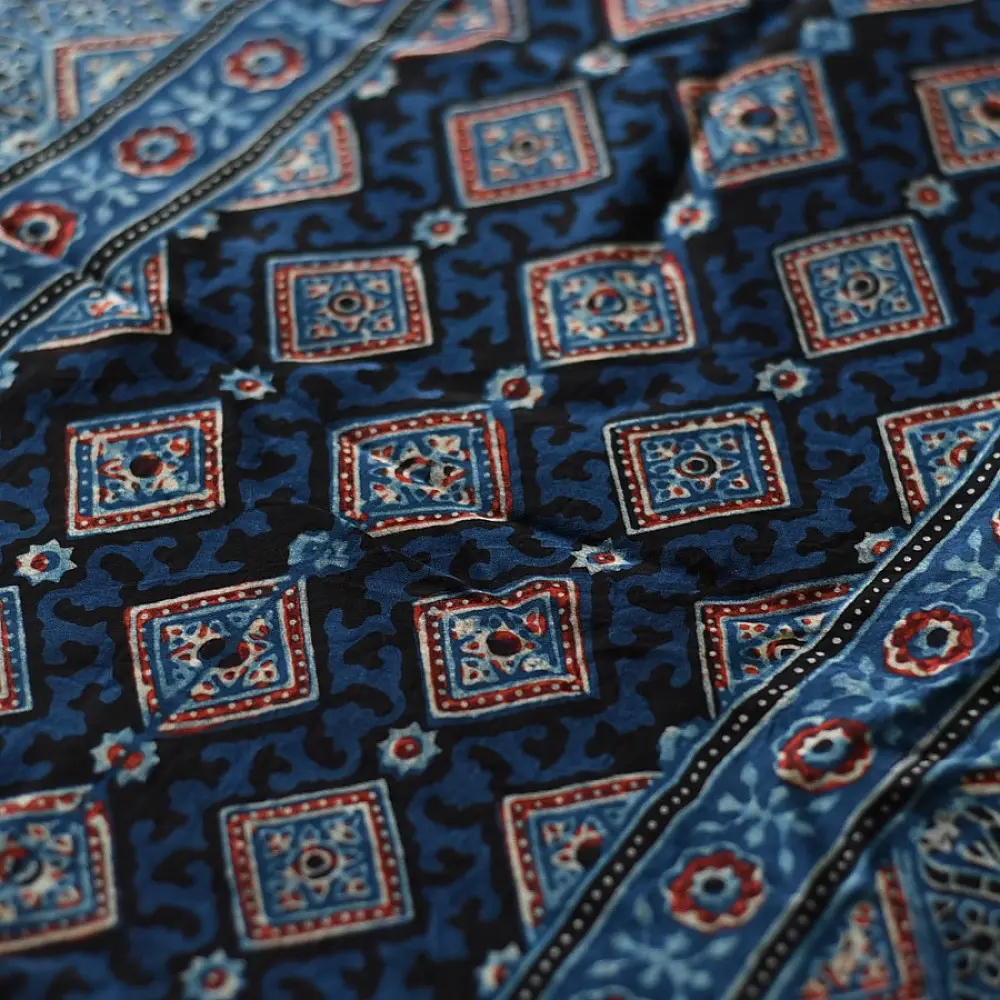 deep indigo blue madder red ajrakh modal silk saree hand block printed geometric buti body bundi medley polka dot pallu traditional ethnic wear sustainable luxury natural dyed with tassels