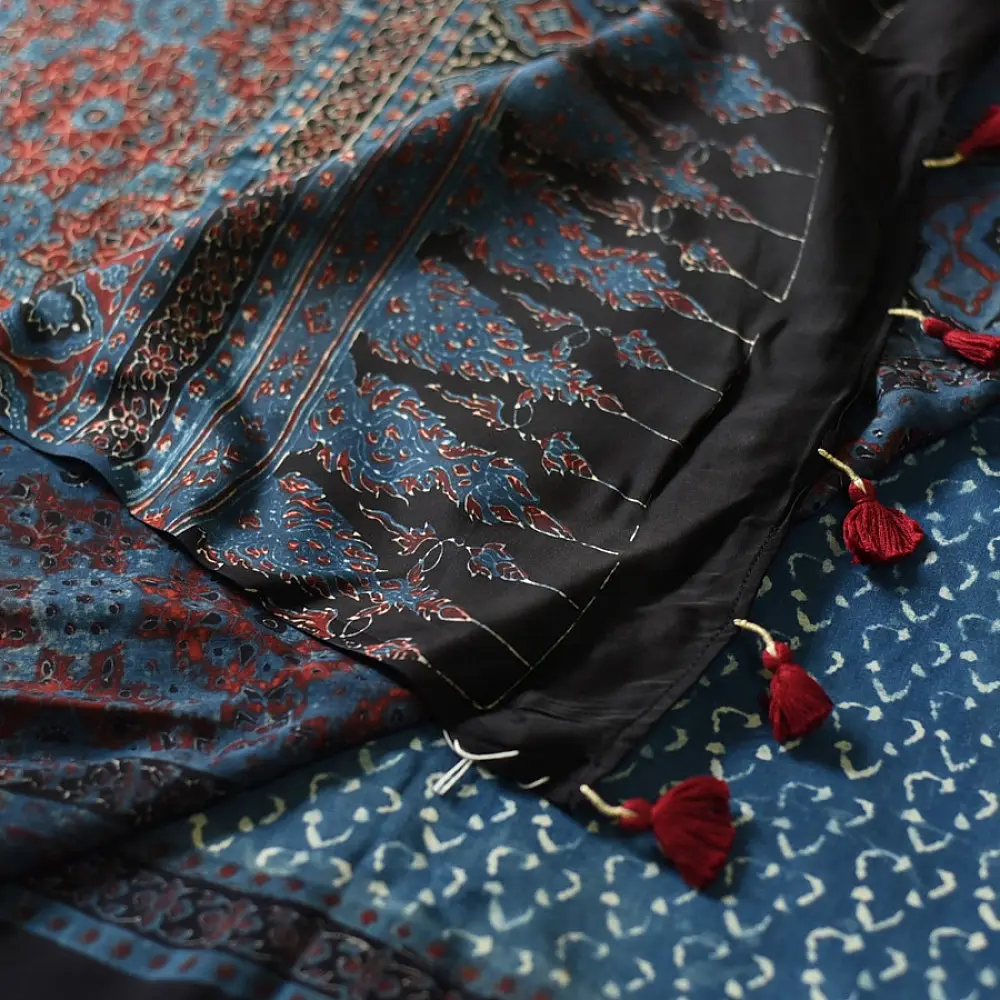 deep indigo blue madder red ajrakh saree hand block printed hexagonal honeycomb beehive jaal ornate floral pallu traditional ethnic wear sustainable fashion natural dyed with tassels