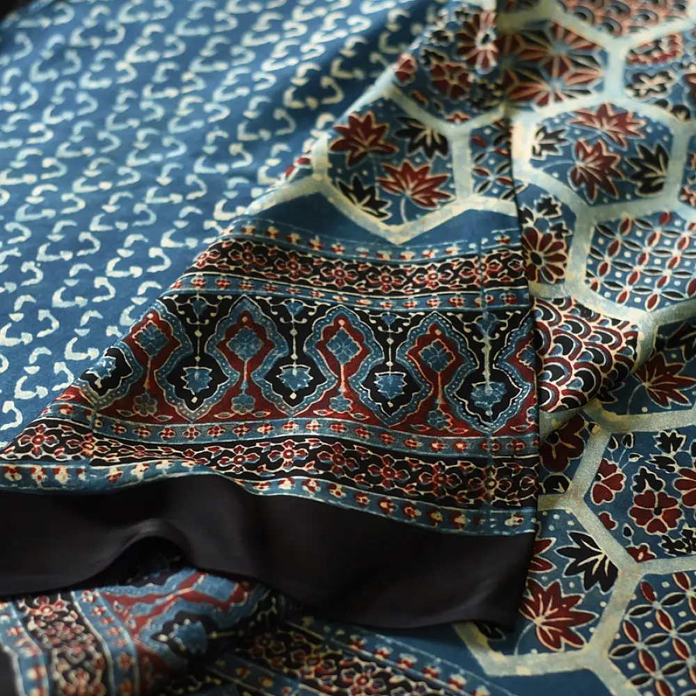 deep indigo blue madder red ajrakh saree hand block printed hexagonal honeycomb beehive jaal ornate floral pallu traditional ethnic wear sustainable fashion natural dyed with tassels