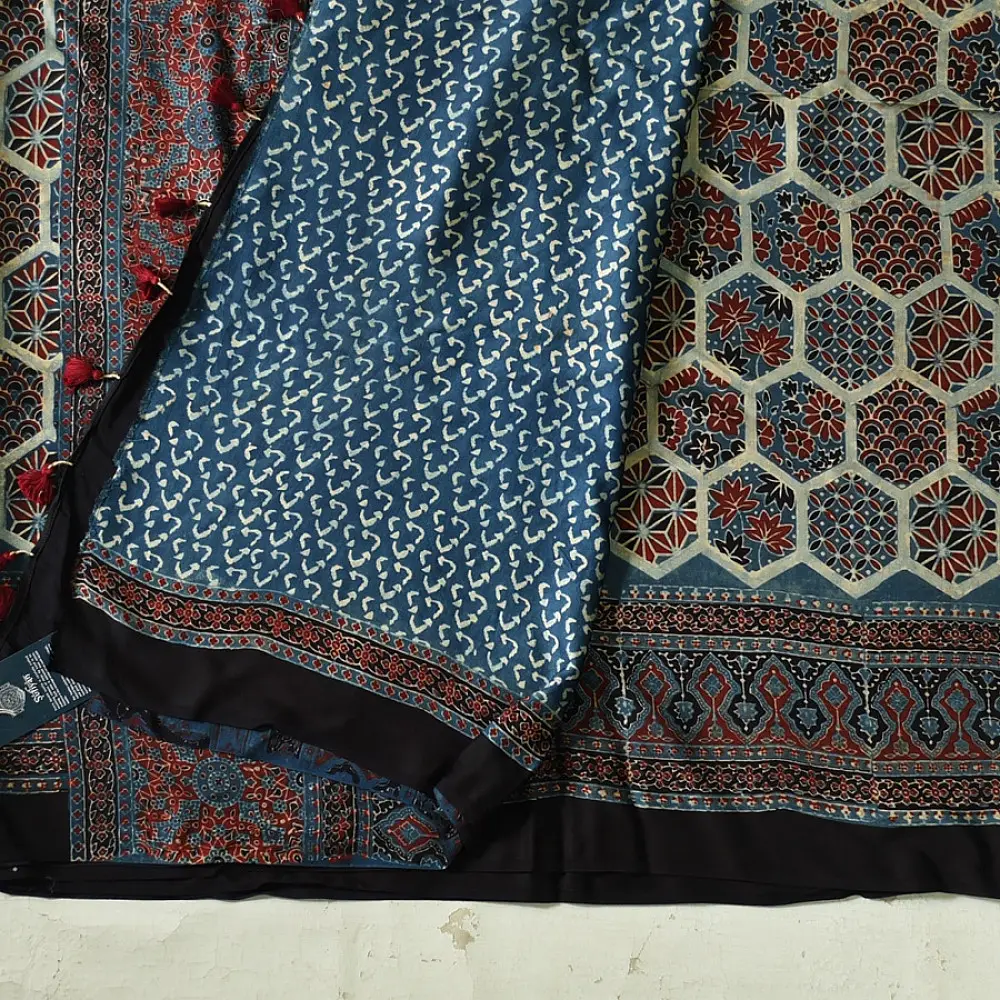deep indigo blue madder red ajrakh saree hand block printed hexagonal honeycomb beehive jaal ornate floral pallu traditional ethnic wear sustainable fashion natural dyed with tassels