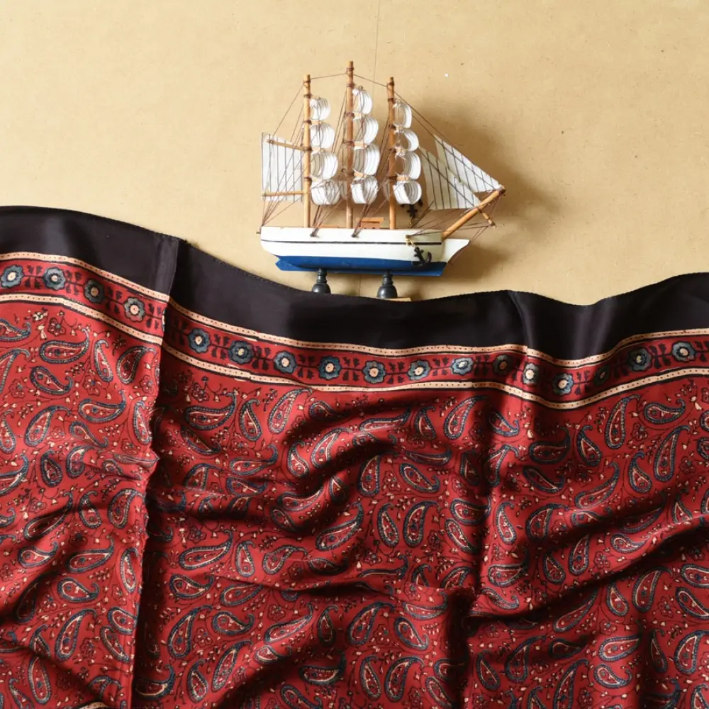 madder red indigo blue ajrakh modal silk dupatta hand block printed paisley kalka jaal body ornate circular bundi medallion pallu traditional mihrab arched detail wedding festive wear sustainable luxury natural dyed with tassels