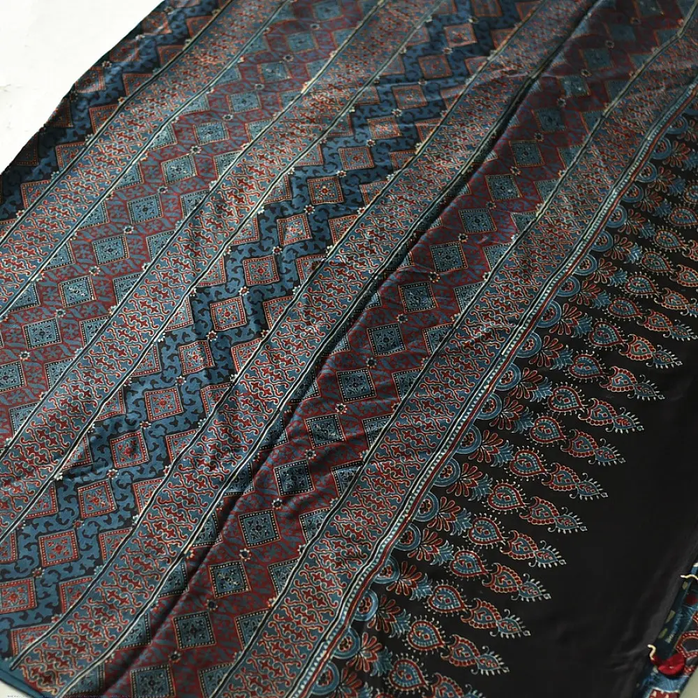 deep indigo blue madder red ajrakh modal silk saree hand block printed checkerboard chowk geometric jaal bundi medley polka dot pallu traditional ethnic wear sustainable luxury natural dyed with tassels