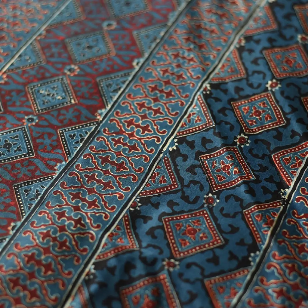 deep indigo blue madder red ajrakh modal silk saree hand block printed checkerboard chowk geometric jaal bundi medley polka dot pallu traditional ethnic wear sustainable luxury natural dyed with tassels
