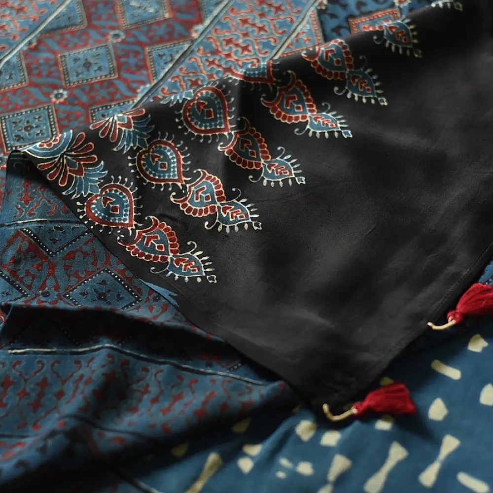 deep indigo blue madder red ajrakh modal silk saree hand block printed checkerboard chowk geometric jaal bundi medley polka dot pallu traditional ethnic wear sustainable luxury natural dyed with tassels