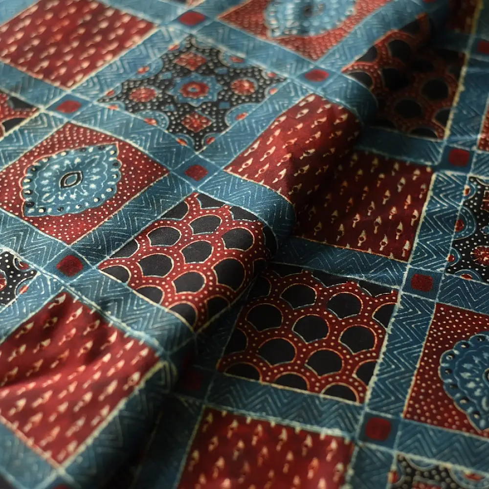 deep indigo blue madder red ajrakh modal silk saree hand block printed checkerboard chowk geometric jaal bundi medley polka dot pallu traditional ethnic wear sustainable luxury natural dyed with tassels