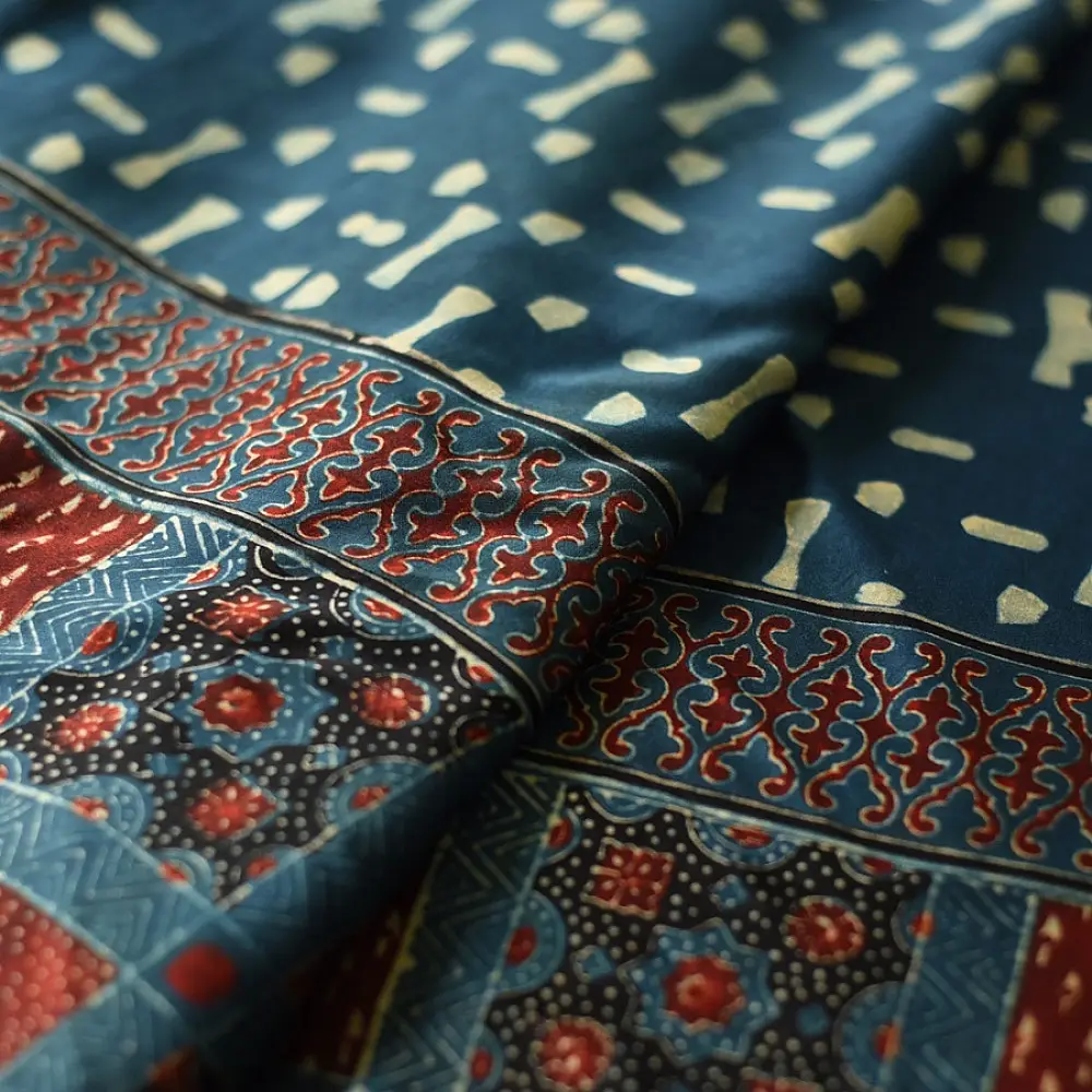 deep indigo blue madder red ajrakh modal silk saree hand block printed checkerboard chowk geometric jaal bundi medley polka dot pallu traditional ethnic wear sustainable luxury natural dyed with tassels