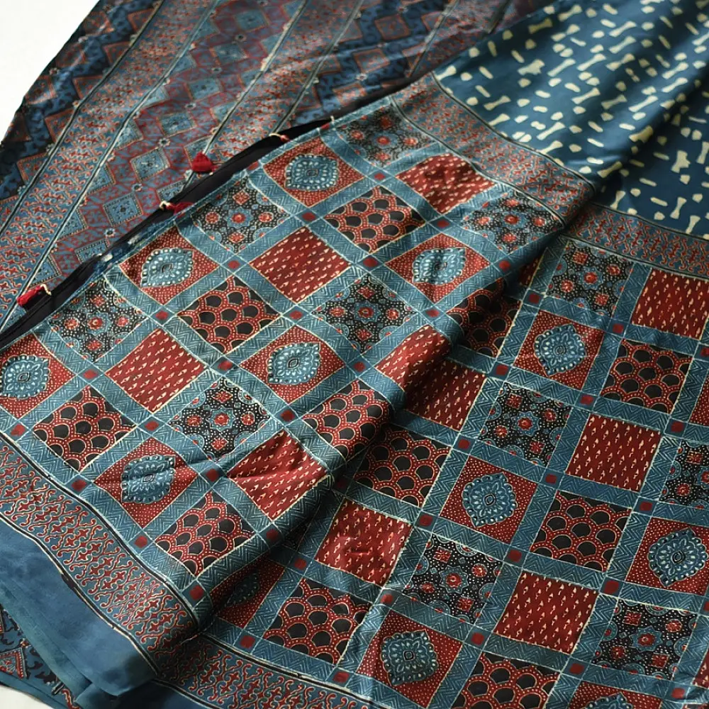 deep indigo blue madder red ajrakh modal silk saree hand block printed checkerboard chowk geometric jaal bundi medley polka dot pallu traditional ethnic wear sustainable luxury natural dyed with tassels