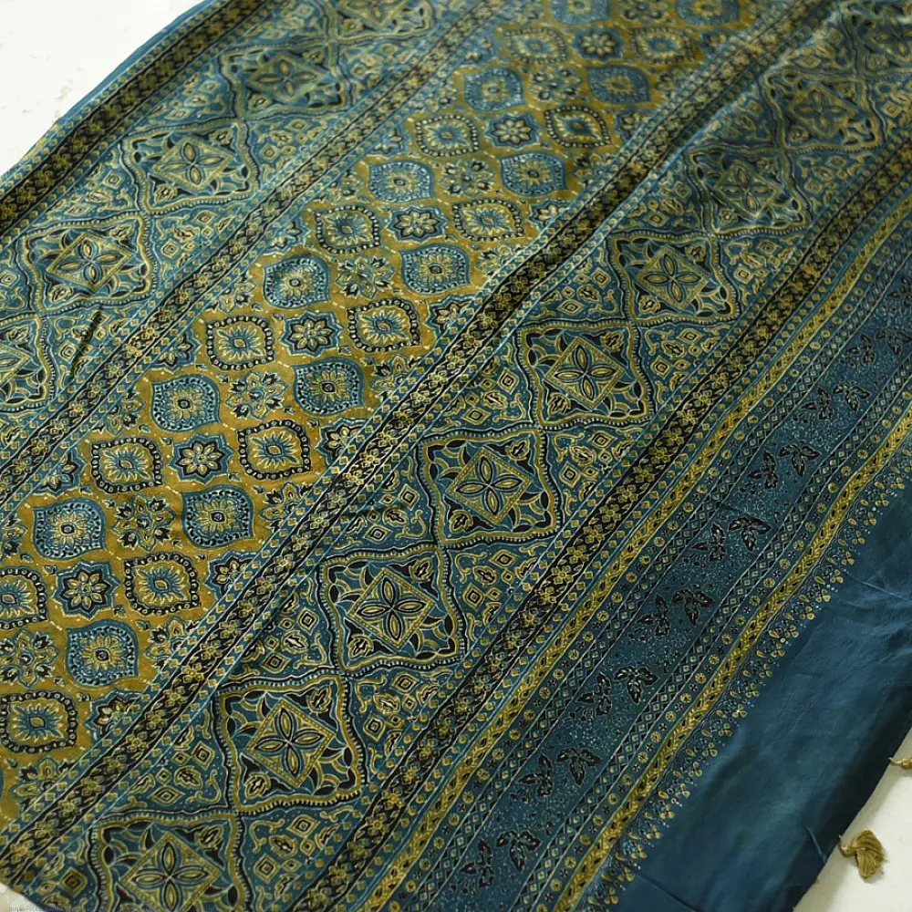 teal blue mustard gold ajrakh saree hand block printed floral medallion jaal traditional geometric borders ethnic wear sustainable fashion natural dyed with tassels