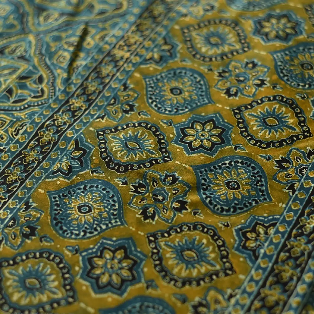 teal blue mustard gold ajrakh saree hand block printed floral medallion jaal traditional geometric borders ethnic wear sustainable fashion natural dyed with tassels