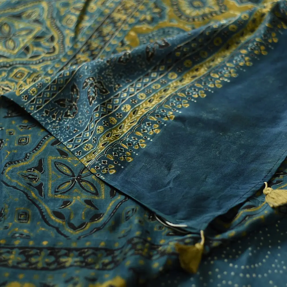 teal blue mustard gold ajrakh saree hand block printed floral medallion jaal traditional geometric borders ethnic wear sustainable fashion natural dyed with tassels