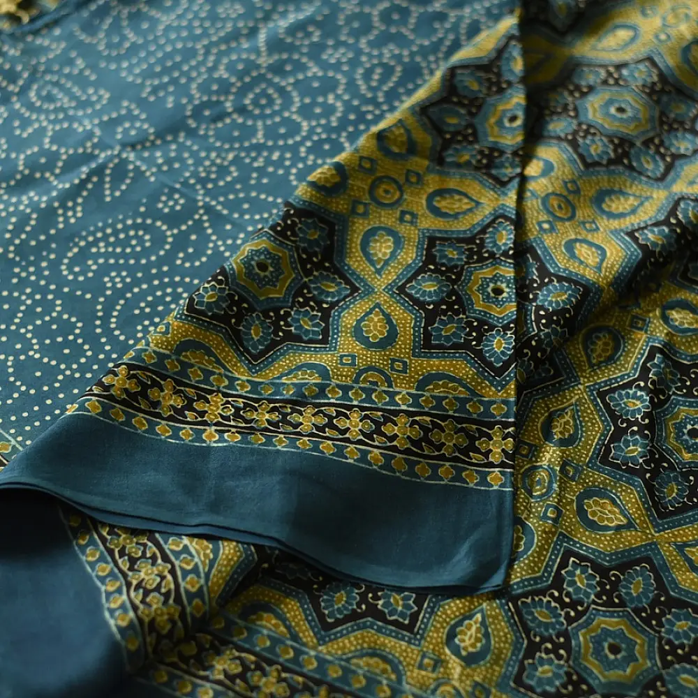 teal blue mustard gold ajrakh saree hand block printed floral medallion jaal traditional geometric borders ethnic wear sustainable fashion natural dyed with tassels