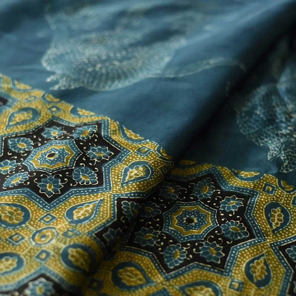 teal blue mustard gold ajrakh saree hand block printed floral medallion jaal traditional geometric borders ethnic wear sustainable fashion natural dyed with tassels
