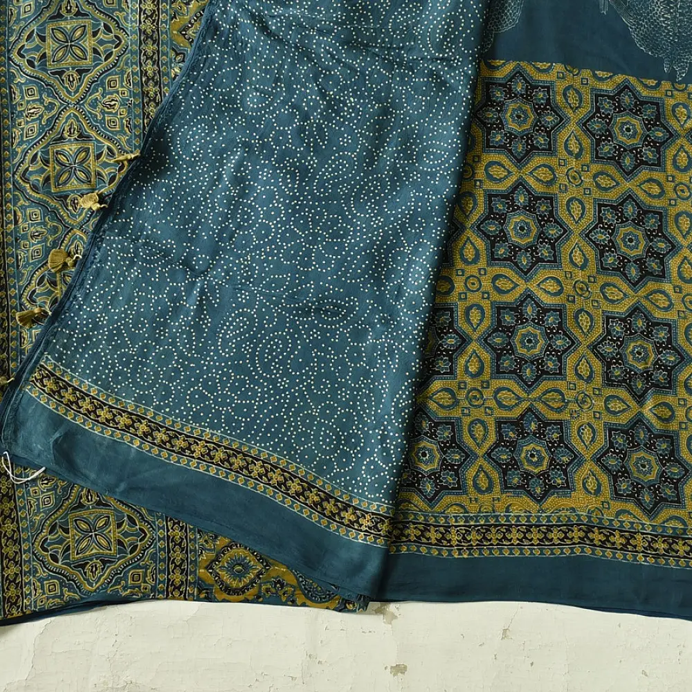 teal blue mustard gold ajrakh saree hand block printed floral medallion jaal traditional geometric borders ethnic wear sustainable fashion natural dyed with tassels
