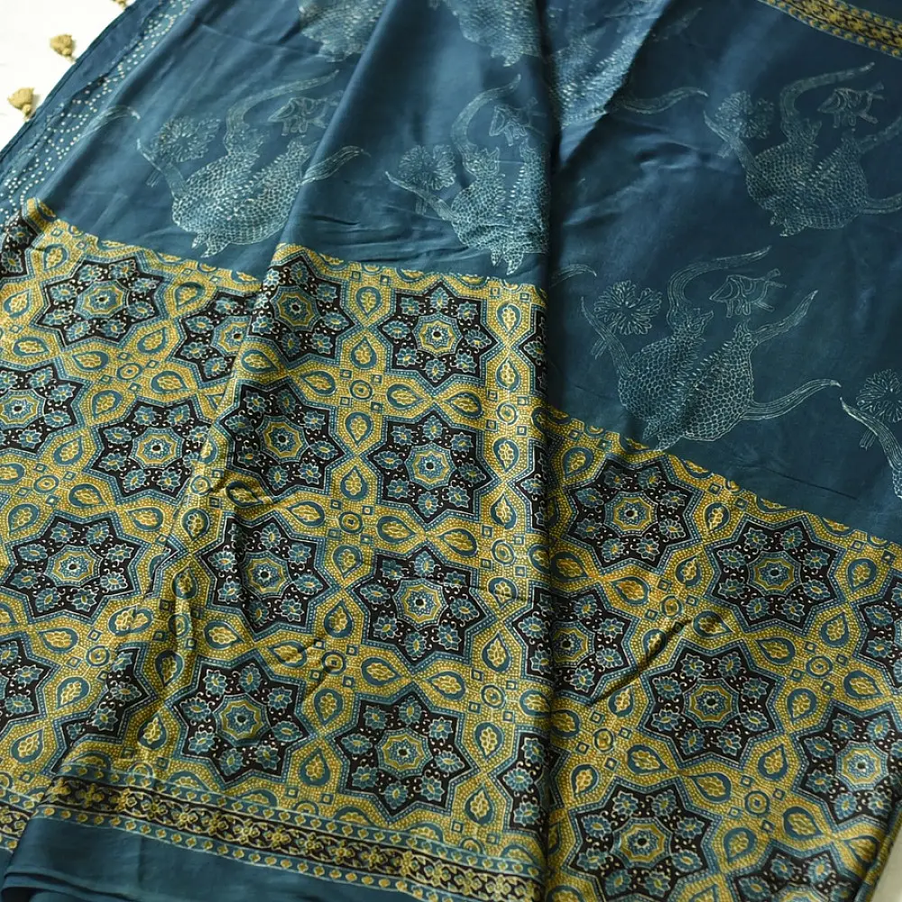 teal blue mustard gold ajrakh saree hand block printed floral medallion jaal traditional geometric borders ethnic wear sustainable fashion natural dyed with tassels