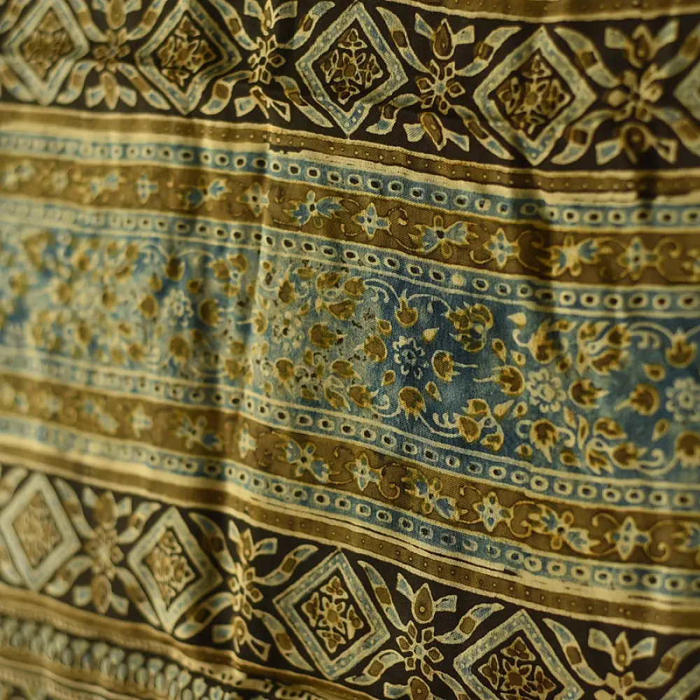 chocolate brown indigo teal ajrakh modal silk dupatta hand block printed floral vine jaal body ornate geometric lozenge pallu traditional mihrab arched detail wedding festive wear sustainable luxury natural dyed with tassels Fish Motif