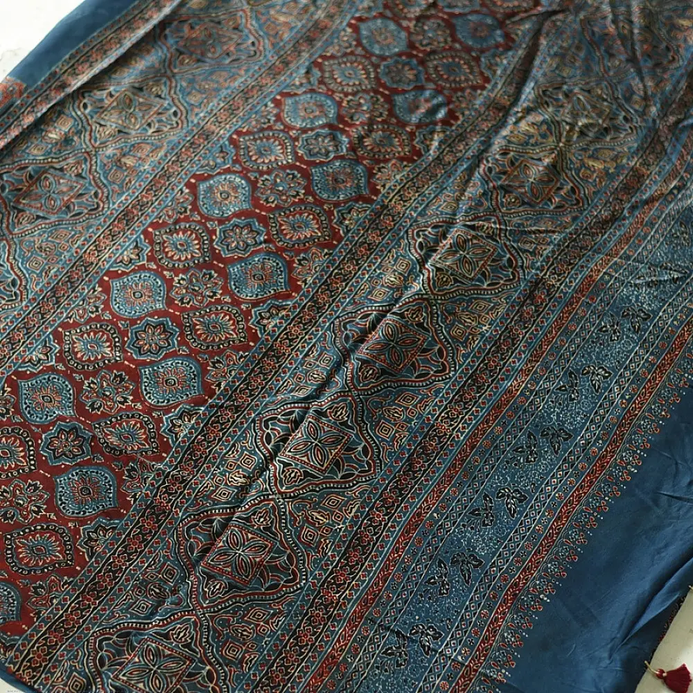 deep indigo blue madder red ajrakh modal silk saree hand block printed octagonal star jaal ornate floral mandala pallu traditional ethnic wear sustainable luxury natural dyed with tassels