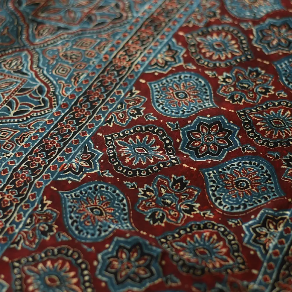 deep indigo blue madder red ajrakh modal silk saree hand block printed octagonal star jaal ornate floral mandala pallu traditional ethnic wear sustainable luxury natural dyed with tassels